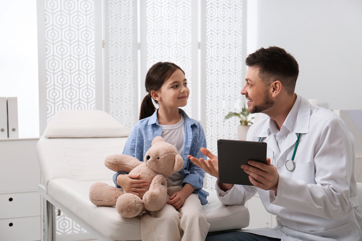 Pediatrician Explaining Physical Examination Result to Little Gi