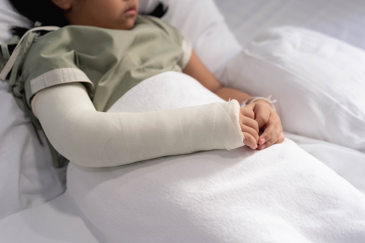 Child in Hospital with Arm Cast