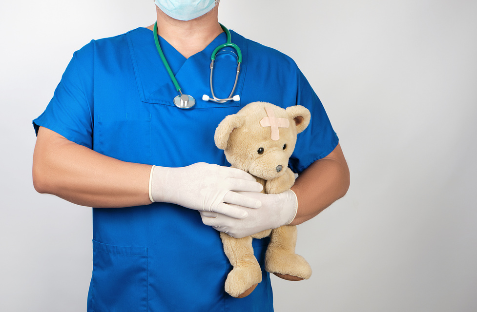 Pediatrician Holding a Teddy Bear